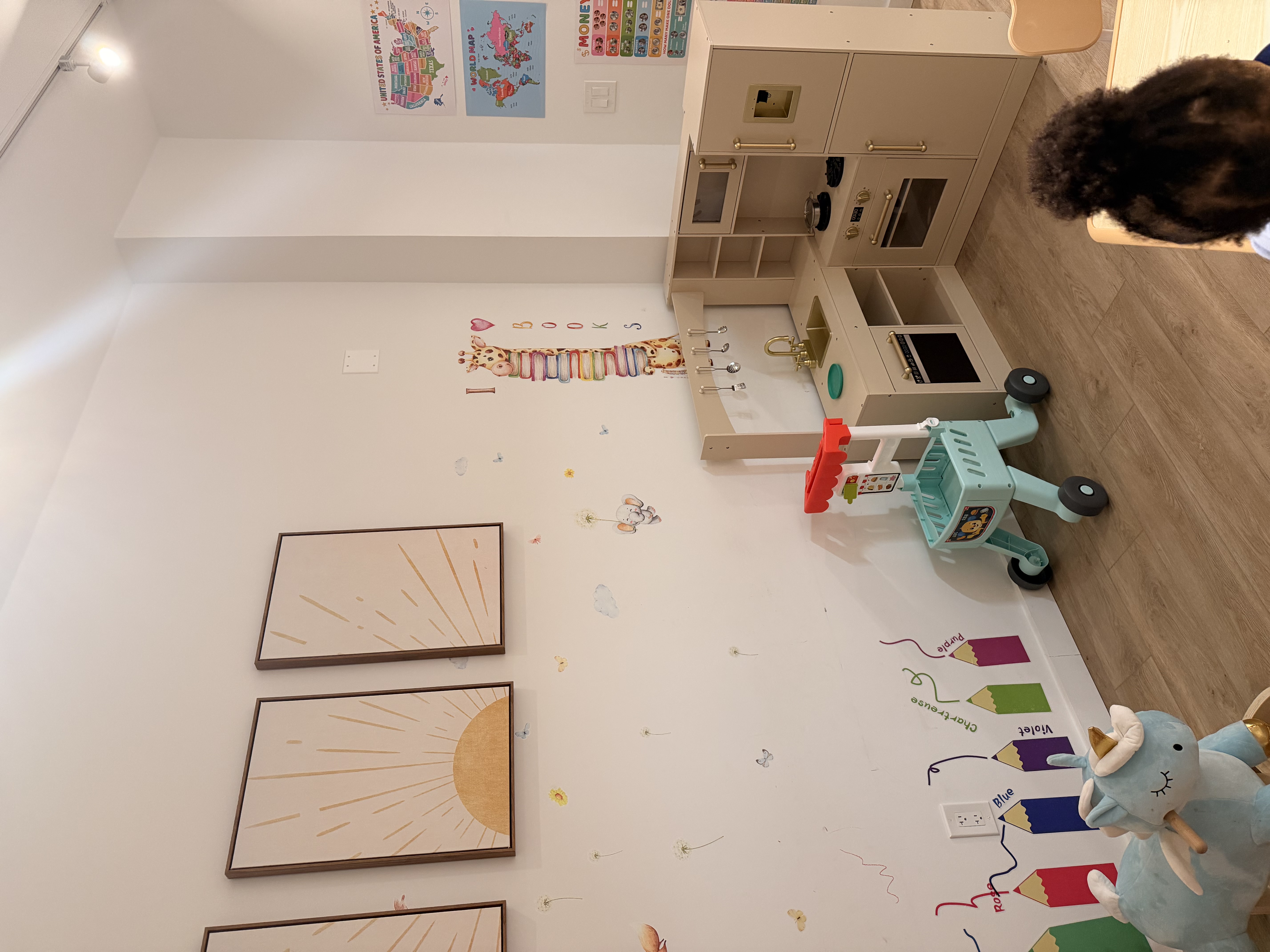 Bright Nest classroom play kitchen and learning wall
